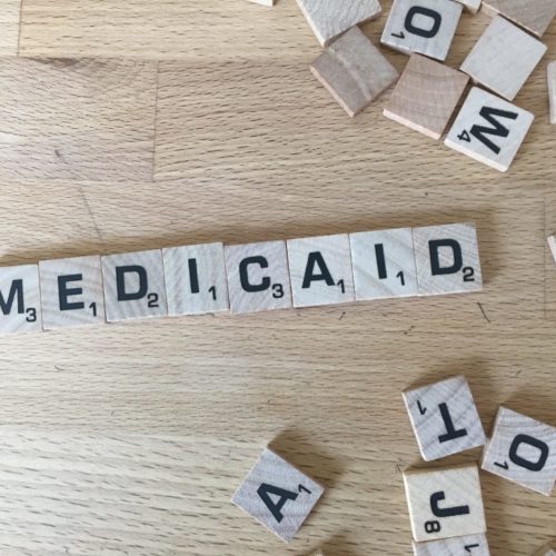 scrabble tiles spelling out Medicaid