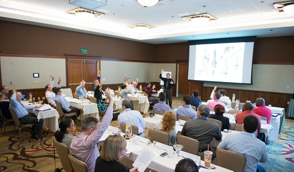 People sitting a tables for a training session