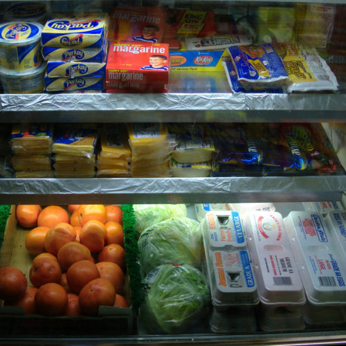 dairy and produce in a grocery store shelf