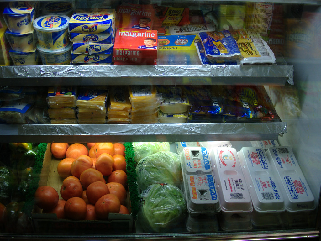 dairy and produce in a grocery store shelf
