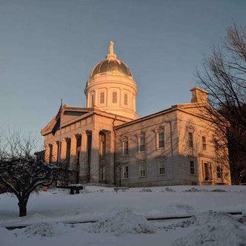 granite building with columns and dome at dawn