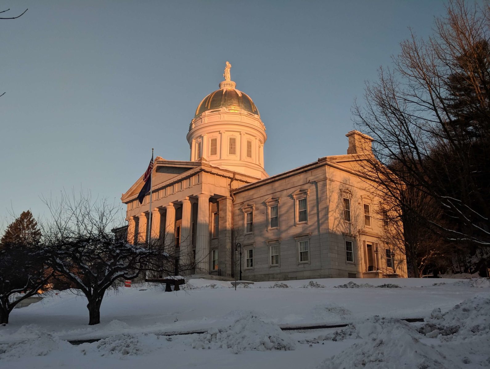 granite building with columns and dome at dawn