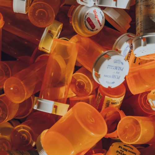 pile of orange pill bottles
