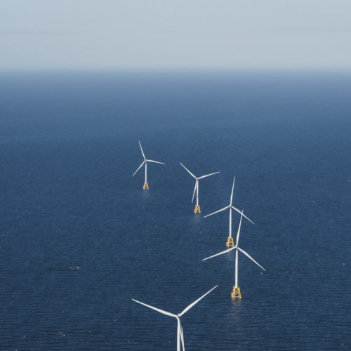 wind turbines in ocean.
