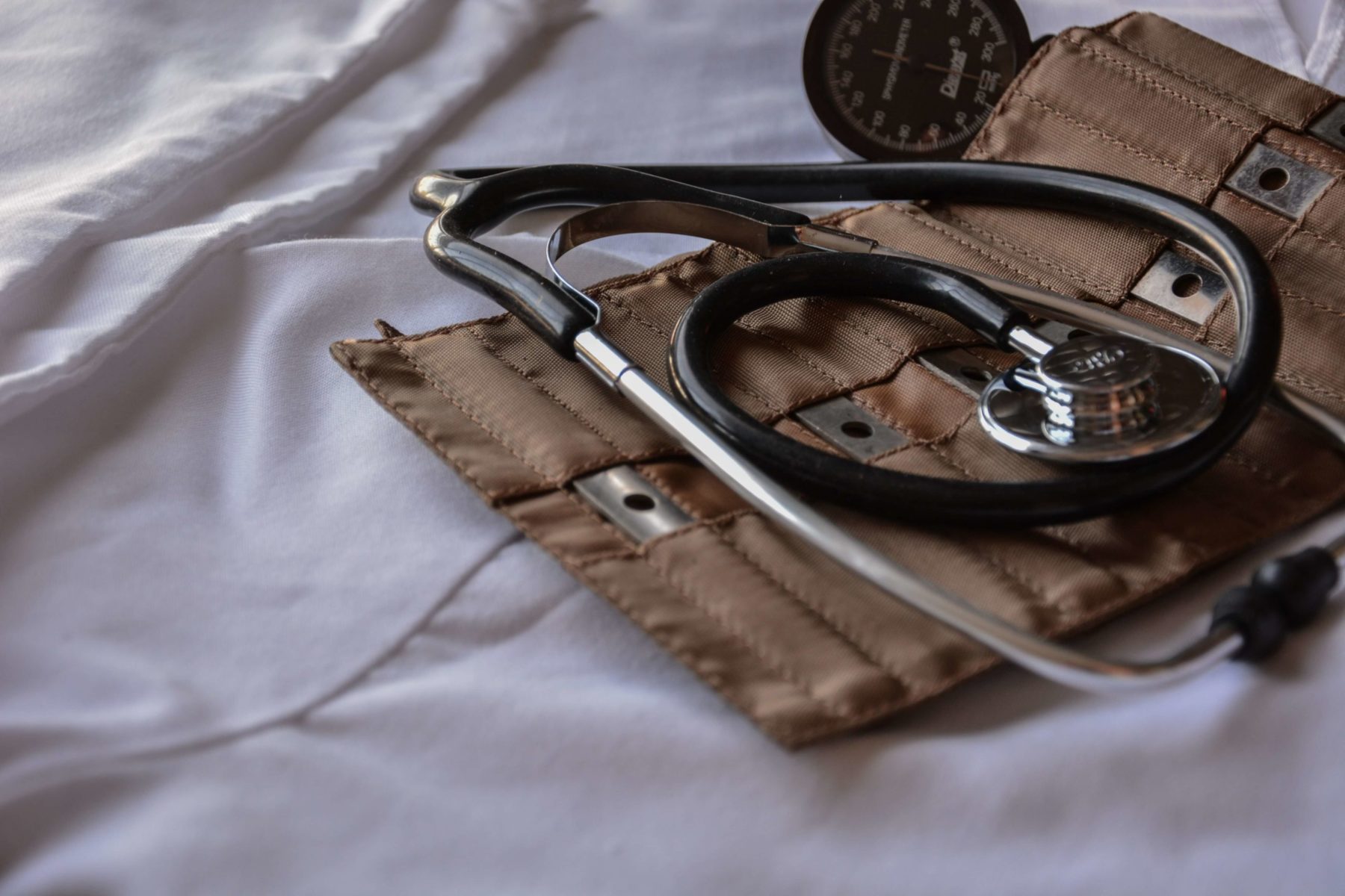 stethoscope and brown blood pressure cuff