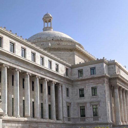 white marble building with columns and dome