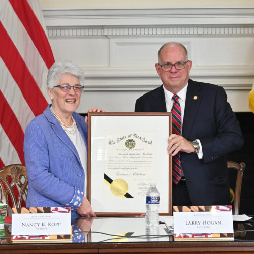 Photo of Nancy Kopp receiving an award from Maryland Governor Larry Hogan